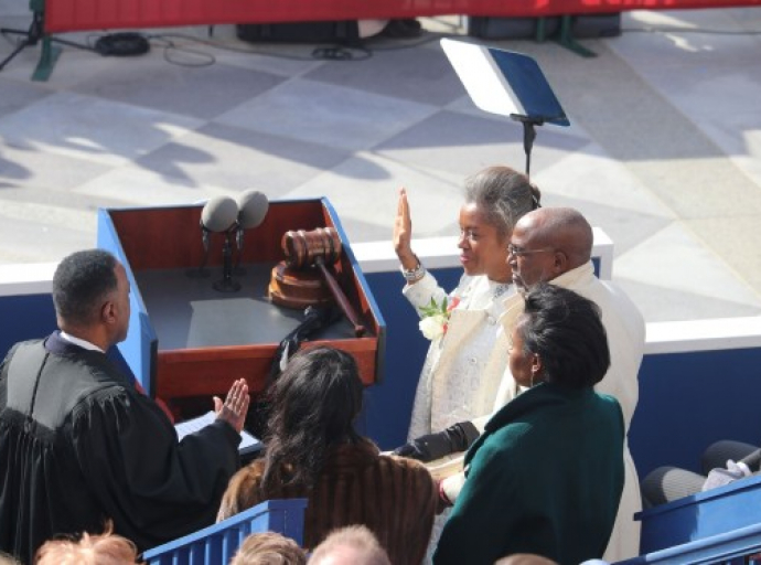 Trailblazing lieutenant governor: Winsome Earle-Sears (at right), being sworn this past Saturday as the 42nd lieutenant governor of the Commonwealth of Virginia, USA. Among her many firsts, the Jamaican-born Ms. Sears is the first woman of color to be the state’s lieutenant governor, after winning election last November. Administering the oath of office to the lieutenant governor is Hon. Richard D. Taylor, Jr., retired judge of the 13th Judicial Circuit of Virginia. Also on hand for the ceremony on the steps of the Virginia State Capitol in Richmond were the lieutenant governor’s husband, Terence Sears (to her immediate left) as other family members look on. ( Derrick Scott photo) 