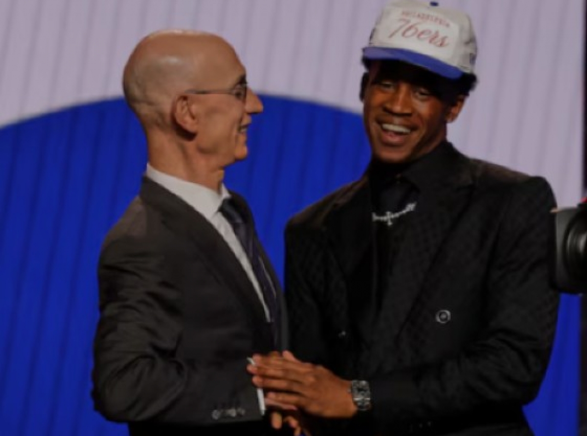 VJ Edgecombe (right) embraces NBA Commissioner Adam Silver after being drafted third by the Philadelphia 76ers in the 2025 NBA Draft