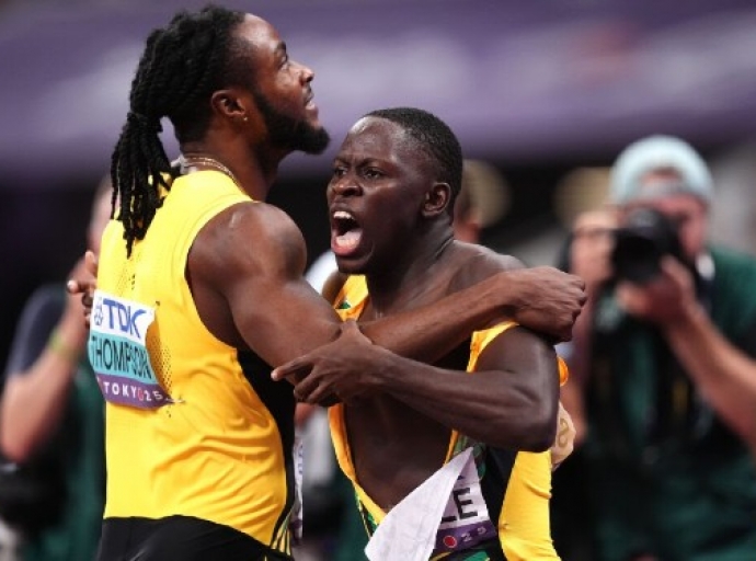 Oblique Seville (right) is congratulated by countryman Kishane Thompson after winning the men’s 100 metres at the World Athletic Championships in Tokyo.