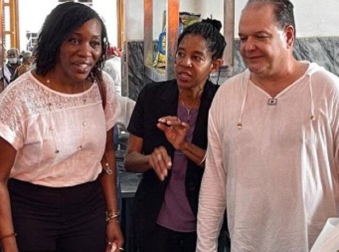 Director of Operations and Advocacy, Edem Wosornu (second left) visits a food canteen in Cuba. Their briefing followed a three-day visit to the island nation.