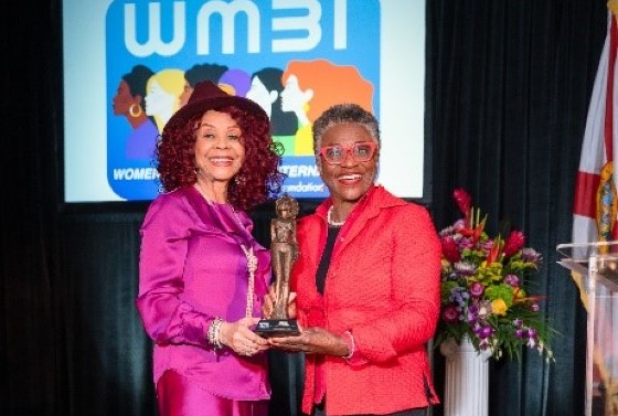 Ms. Anne McNeill (right) receiving the Trailblazing Women 2022 Award from Ms. Marie R. Gill
