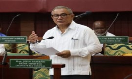 Prime Minister John Briceño announcing new debt restructuring deal with Venezuela in the Parliament (CMC Photo)