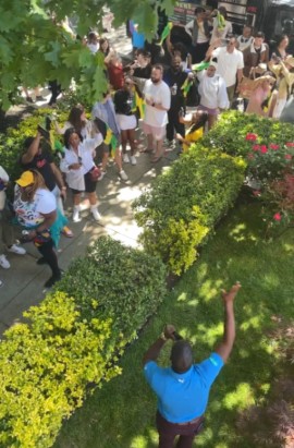 Jamaica Tourist Board Business Development officer for the Northeast USA Kirk Whyte engages participants as they arrive at embassy of Jamaica to celebrated Passport DC "Around the World Embassy Tour" 2023, on Saturday May 6 2023.