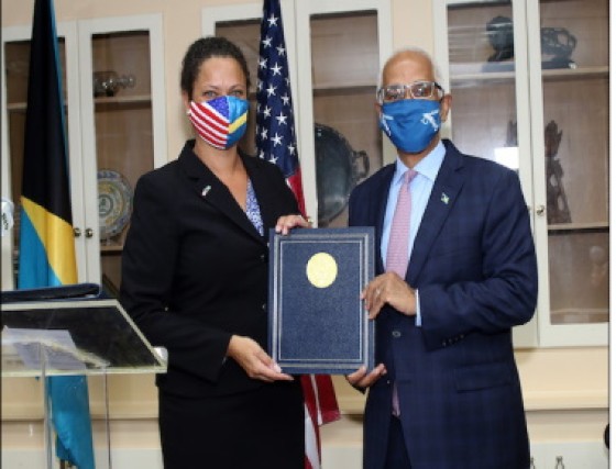 US Embassy Charge d’Affaires Usha Pitts and Tourism and Aviation Minister, Dionisio D’Aguilar, show off the agreement signed between the two countries (BIS Photo/Patrick Hanna)