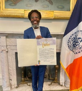 Garfield "Chin" Bourne of Sound Chat Radio and Irish and Chin receives citation from New York City Mayor Eric Adams.