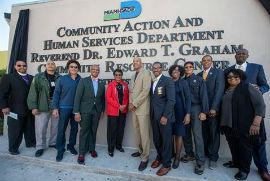 from left to right, Bishop Jimmie L. Williams, Morgan Harris, John Harris, Miami Gardens Mayor Oliver Gilbert, Commissioner Jordan, Richard Harris, FMU President Jaffus Hardrick, Charmaine Sutton, Graham Harris, Miami Gardens Councilman David Williams Jr., Miami-Dade Community Action and Human Services Department Director Lucia Davis-Raiford, and Deputy Mayor Maurice Kemp at the new sign unveiling.