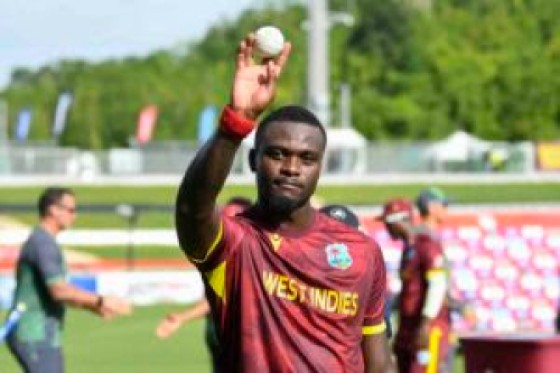 Jayden Seales of the West Indies raises the ball to the crowd after Leading his team to victory in the third and final One Day International (ODI) cricket match between West Indies and Pakistan at Brian Lara Cricket Academy in Tarouba, San Fernando, Trinidad and Tobago on August 12, 2025. (Photo by Randy Brooks / AFP)