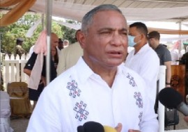 Prime Minister John Briceno speaking with reporters