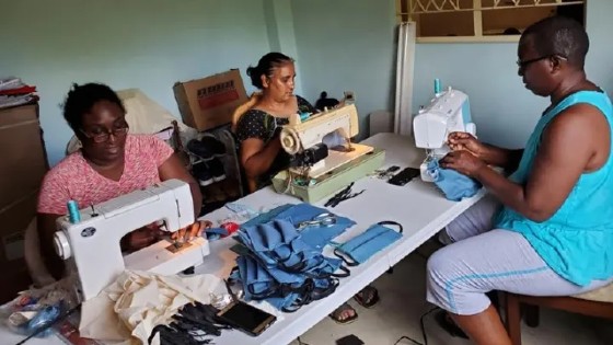 Women sew masks using machines provided by the Women’s Institute for Alternative Development in Trinidad and Tobago. (Photo by: WINAD)