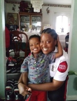 Special Police Officer Maurica Manyan and her 4-year-old son in hipper times.