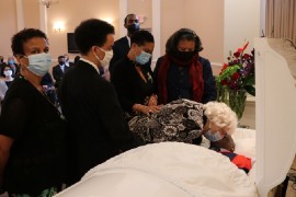 Mrs. Beryl Russell, the widow Rev.  Dr. Horace Russell surrounded by her children , gives a farewell kiss to her husband of 63 years at  on Saturday April 17.2021 at a service of thanksgiving for his life at the  DeBaptiste Funeral home auditorium at the town of Bryan Mawr, near Philadelphia in Pennsylvania, USA.   (Photo Derrick Scott)