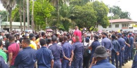Police officers block the entrance of the Office of the President Santokhi as demonstrators demand his resignation over his socio-economic policies (CMC Photo)