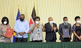 From left to right: Kenya’s Minister of Foreign Affairs, Raychelle Omamo; Kenya’s President Uhuru Kenyatta; Prime Minister Mia Amor Mottley; Minister of Foreign Affairs and Foreign Trade, Senator Dr. Jerome Walcott; Minister of the Environment and National Beautification, Adrian Forde; and Minister of Tourism and International Transport, Senator Lisa Cummins, at the signing ceremony.