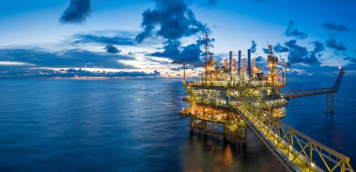 Panorama of Oil and Gas central processing platform in twilight, offshore hard work occupation twenty four working hours. 