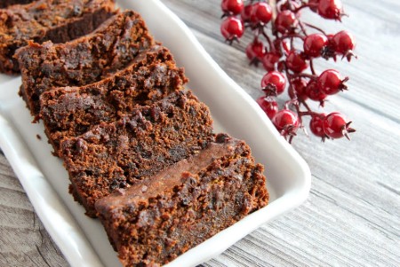 Slices of Caribbean Christmas Black Fruit Cake on white tray