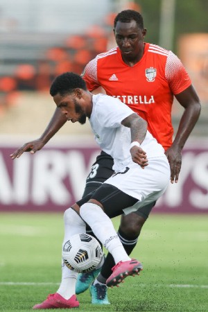SANTIAGO DE LOS CABALLEROS, REPUBLICA DOMINICANA. MAY 17th: Dairin Gonzalez #13 of Cibao FC vs Ronaldo Webster #7 of Cavalier SC during the match between Cibao FC vs Cavalier SC as part of the Flow Concacaf Caribbean Club Championship held at the Estadio Cibao stadium in Santiago de los Caballeros, Republica Dominicana.(PHOTO BY MIGUEL GUTIERREZ/CONCACAF/STRAFFON IMAGES/MANDATORY CREDIT/EDITORIAL USER/NOT FOR SALE/NOT ARCHIVE)