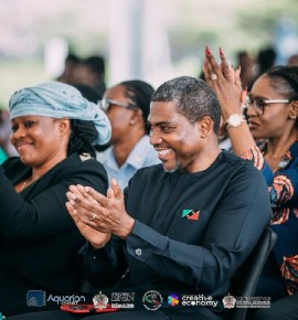 Prime Minister of St. Kitts and Nevis, Hon. Dr. Terrance Drew, r., and Aisha Maina, l.