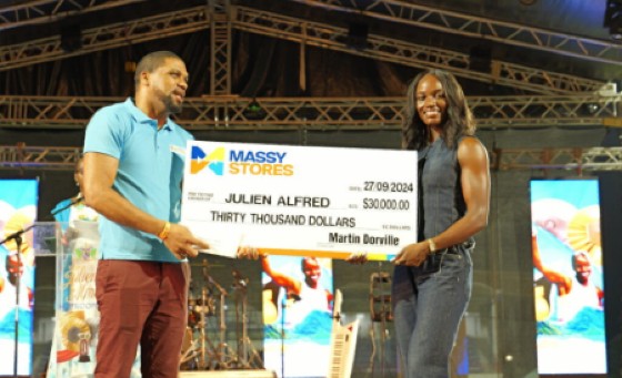 Massy Stores awarded Julien Alfred $30, 000 during the celebratory concert at the Daren Sammy Cricket Ground on Friday.