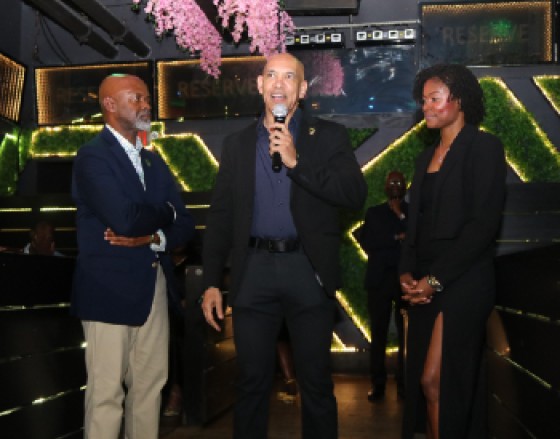 Jamaica’s Ambassador to the United States, Major General (Ret’d) Antony Anderson, delivers remarks at Team Jamaica Bickle’s annual Chairman’s Reception at Reserve Wine and Bar Lounge in downtown Philadelphia on Friday, April 24, 2026. Looking on (from left) are Team Jamaica Bickle President and CEO Irwin Clare Sr and Vice Chair of the organising committee Tashel Jenkins. (Photo by Derrick Scott)