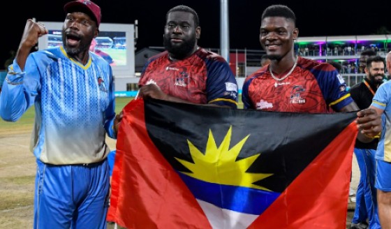 Sir Curtly Ambrose (left) celebrates with players Rahkeem Cornwall (centre) and Alzarri Joseph after winning the CPL title