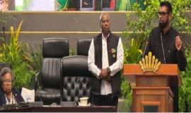 CARICOM Secretary General, Dr. Carla Barnett, listens attentively as President Irfaan Ali addresses opening of CARPHA’s 70th annual meeting in Guyana.