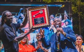 Buju Banton being presented with the Keys to the City of Tamarac by Vice Mayor Marlon Bolton at Yard on the Lawn. (via X)