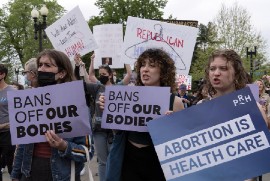 Demonstrators protest outside of the U.S. Supreme Court on Tuesday, May 3, 2022. (AP Photo/Jose Luis Magana)