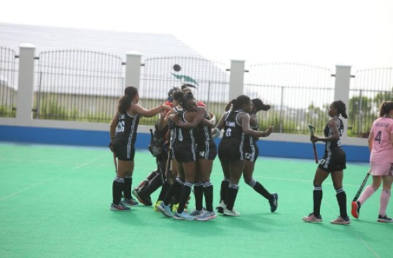 Guyana women celebrate after scoring the winning goal against Bermuda.