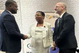 PAHO/WHO Representative to Jamaica, Bermuda, and the Cayman Islands, Ian Stein, (right) greets senior ministry officials at he launch (JIS Photo)