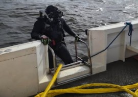 A diver prepares to enter the waters as the search continues for survivors of last Saturday’s boating incident (Photo courtesy NEWS SOURCE)