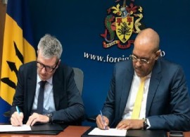 Caribbean Country Director of the United Nations World Food Programme, Brian Bogart, and Minister of Foreign Affairs and Foreign Trade, Kerrie Symmonds, sign the Letter of Understanding at the Ministry of Foreign Affairs and Foreign Trade. (BGIS Photo)