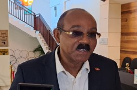 Prime Minister Gaston Browne speaking to reporters at the CARICOM summit in St Lucia (CMC Photo)