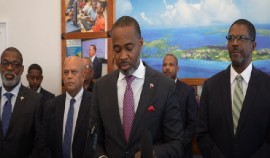 Premier David Burt flanked by members of his Cabinet at news conference (CMC Photo)