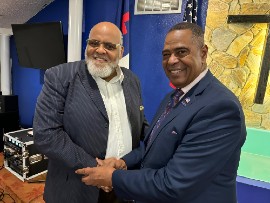 Stanley Campbell, candidate for U.S. Senate, shaking hands with Bishop James David Stockton III, candidate for U.S. District House 6 seat.