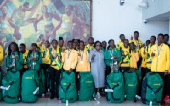 Jamaica Sports Minister Olivia Grange (c) greets the Carifta team on arrival in Kingston on Tuesday. Photo: MCGESjamaica