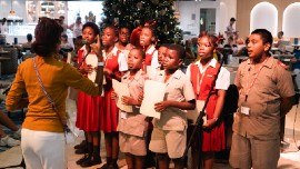 Students from St. Mary’s Primary School spread holiday cheer on board P&O Cruises’ Britannia with a heartwarming Christmas carol performance.