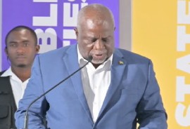 Guyana’s Prime Minister Mark Phillips addressing the launch of CDM-14 (CMC photo)