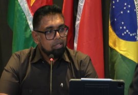 Guyana’s President Dr. irfaan Ali , who is also the CARICOM chairman, speaking at news conference on Monday night (CCMC Photo)