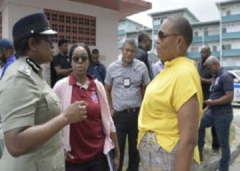Police Commissioner, Erla Harewood-Christopher, speaking with residents of cocorite following the murders (TTPS Photo)