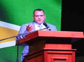 Housing Minister Colin Croal addressing the opening of the International Building Expo