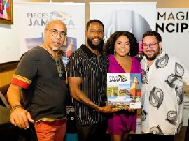 Sean Henry (left) and David I. Muir (right), co-author of Pieces of Jamaica, with guests at an Island SPACE Caribbean Museum book signing in 2022. (Photo courtesy of Island Syndicate)
