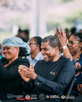 Prime Minister of St. Kitts and Nevis, Hon. Dr. Terrance Drew, right, and Aisha Maina, left