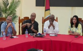 Public Works Minister Juan Edghill (second from left) flanked by Prime Minister Mark Phillips in white shirt and two other government ministers at the news conference on Sunday night (CMC Photo)