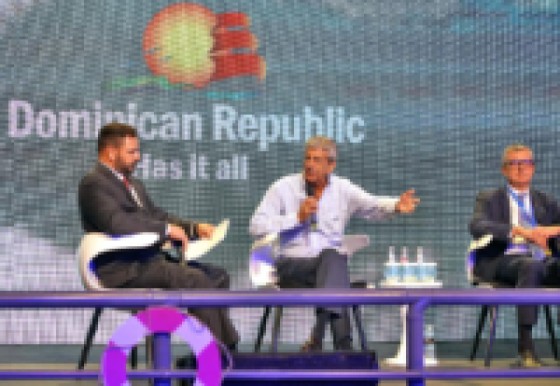Rick Sasso, Chairman of MSC Cruises USA, makes a point during the FCCA Cruise Conference in Santo Domingo. At left is FCCA President Adam Ceserano, while Michael Bayley, President & CEO of Royal Caribbean International, is at right.