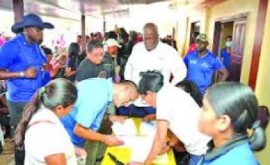 Guyanese nationals registration for GUY$100,000 cash grants from the government