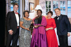 Sherrita Savage (center), Group Reservations Coordinator at Half Moon accepts her Employee of the Year Award at the Forbes Travel Guide 2020 Luxury Summit in Las Vegas. Also sharing in the celebration are from left: Guy Steuart, Chairman of Half Moon; Shernette Crichton, General Manager of Half Moon; Sheila Johnson, CEO of Salamander Hotels and Resorts and Filip Boyen, CEO of Forbes Travel Guide