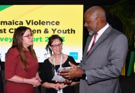 Director General of the Planning Institute of Jamaica, Dr. Wayne Henry (right), in discussion with Deputy Chief of Mission at the United States Embassy in Kingston, Amy Tachco (left), and UNICEF’s Jamaica Representative, Olga Isaza, about the findings of the 2023 Violence Against Children and Youth Survey.