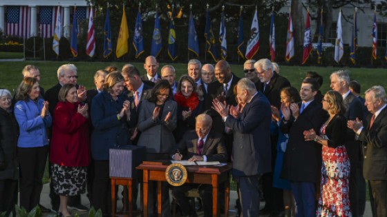 President Joe Biden signs the bipartisan Infrastructure Investment and Jobs Act on Monday during a ceremony on the South Lawn at the White House. (Kenny Holston/Getty Images)