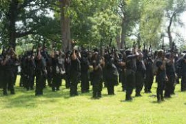 Around 500 armed demonstrators wearing all-black uniforms marched with the “Not Fucking Around Coalition” Saturday in Louisville, Kentucky, drawing hundreds of onlookers and rival militia counter-demonstrators