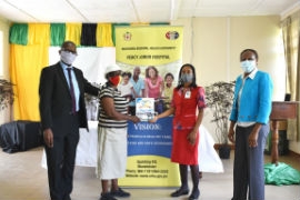 Personnel Officer at the Percy Junor Hospital, Claudia Reynolds (2nd right) presents a copy of the Customer’s Charter to Sonia Newman (2nd left), a customer of the hospital at the re-launch of the Charter. Photographed also are: CEO of the PJH, Carlton Nichols (left) and Parish Manager for the Manchester Health Services, Sandia Chambers-Ferguson.